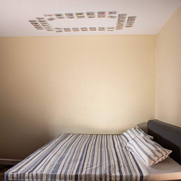 FlexDeez card frame with Block O card displayed above bed