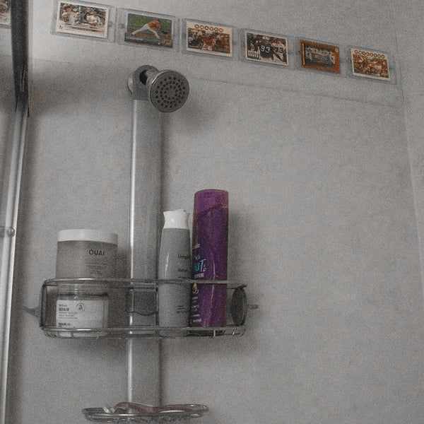 FlexDeez card display installed in a tiled shower wall setting
