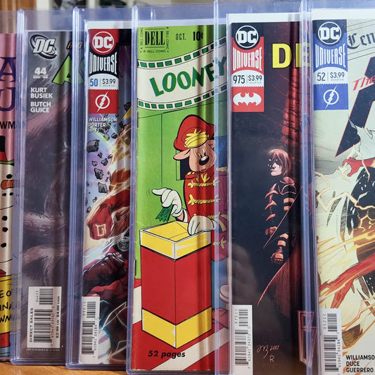 Mixed DC, Marvel, and Looney Tunes comics in FlexDeez wall-mounted cases