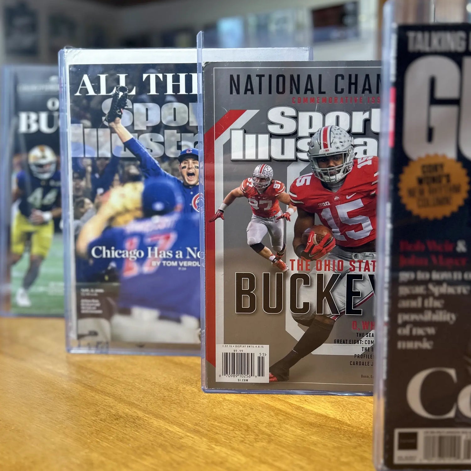 Front view of various Sports Illustrated magazines in FlexDeez cases