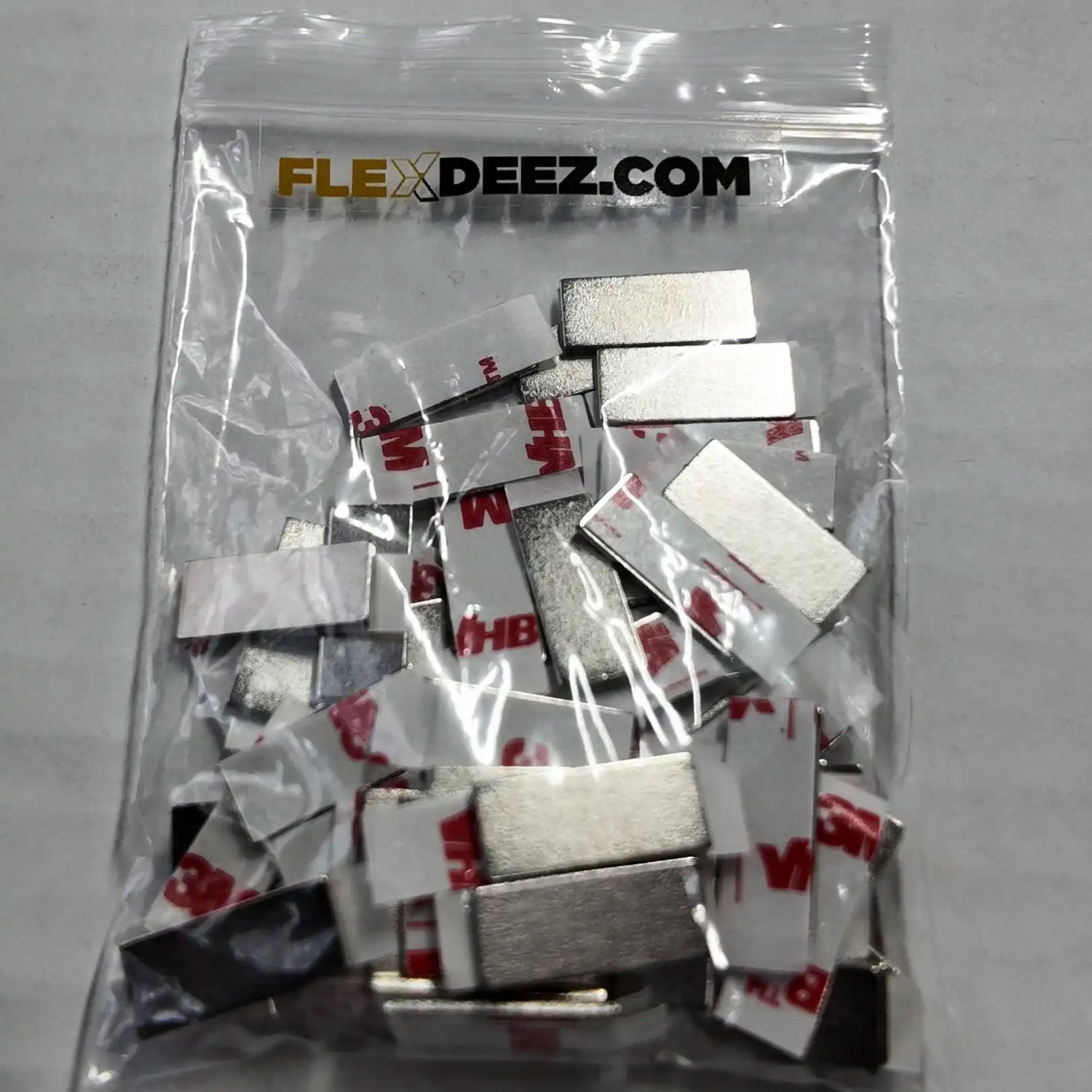 Mounting plates used to install FlexDeez comic and card displays