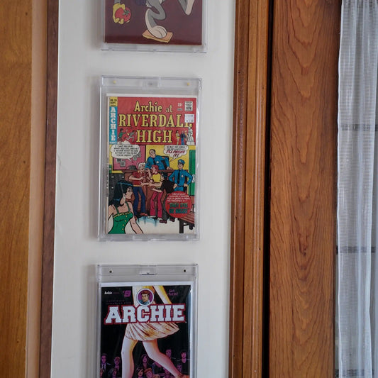 Side view of mounted comic book in FlexDeez OneTouch wall frame