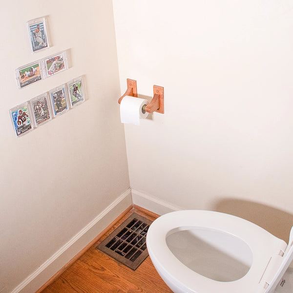 PSA graded card in FlexDeez frames mounted near toilet